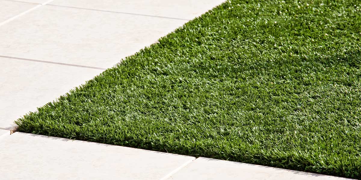 green artificial grass rug